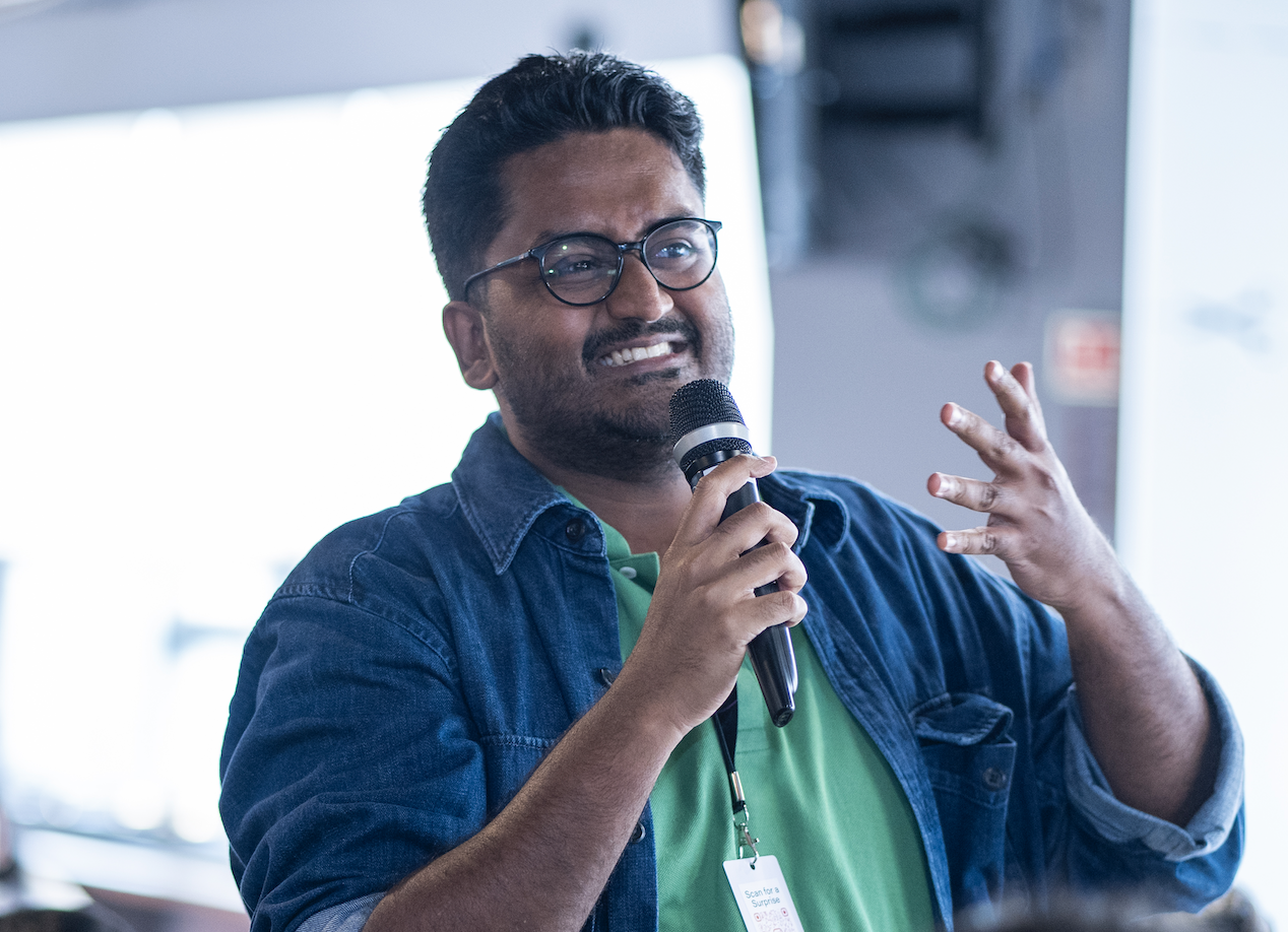 Chandra speaking with a microphone